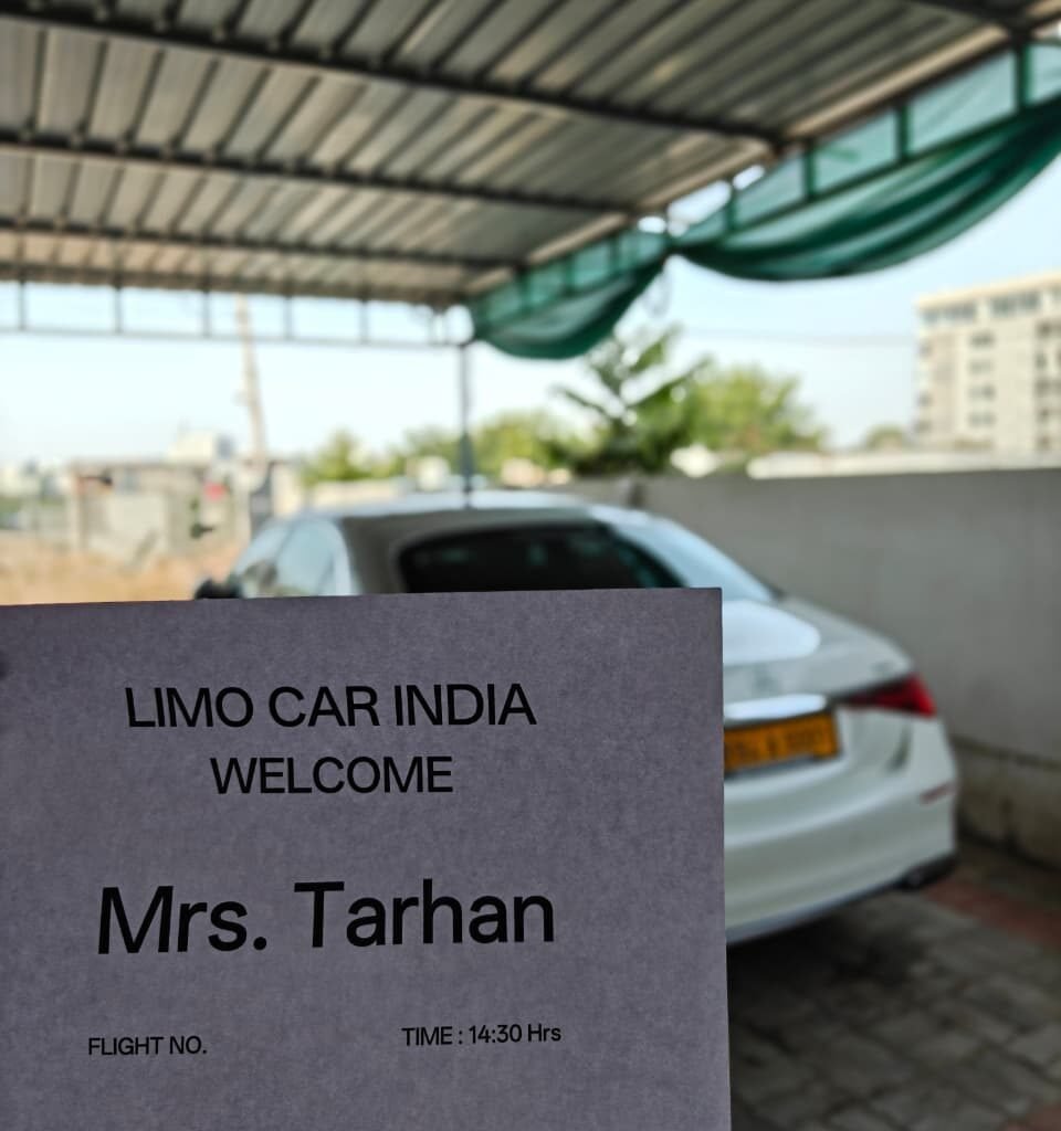 Mercedes-Benz S-Class with personalized airport pickup welcome board by Limo Car India.