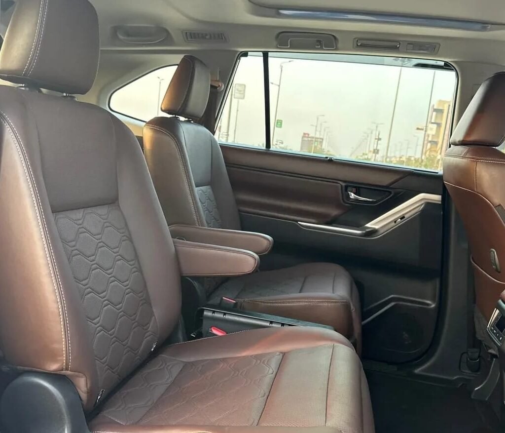 Luxurious second-row captain seats inside the Toyota Innova Hycross with premium leather upholstery and spacious legroom.