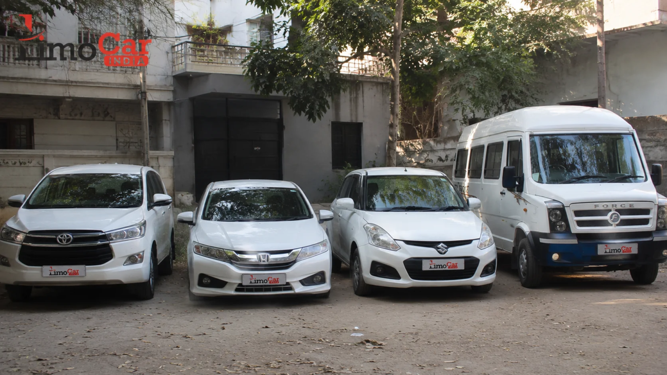 Limo Car India fleet with Innova, sedan and Force Traveller parked at a private property in Jaipur for affordable and luxury car rental services
