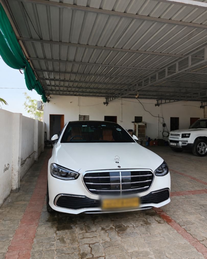 Front exterior of Mercedes-Benz S450 luxury sedan with signature grille and LED headlights.
